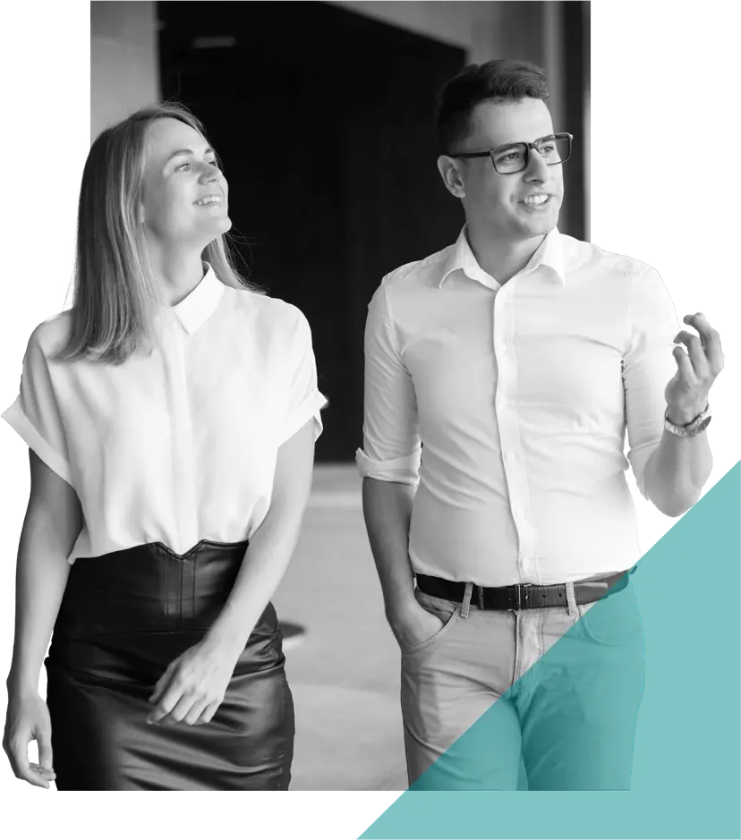 two coworkers having a discussion while walking